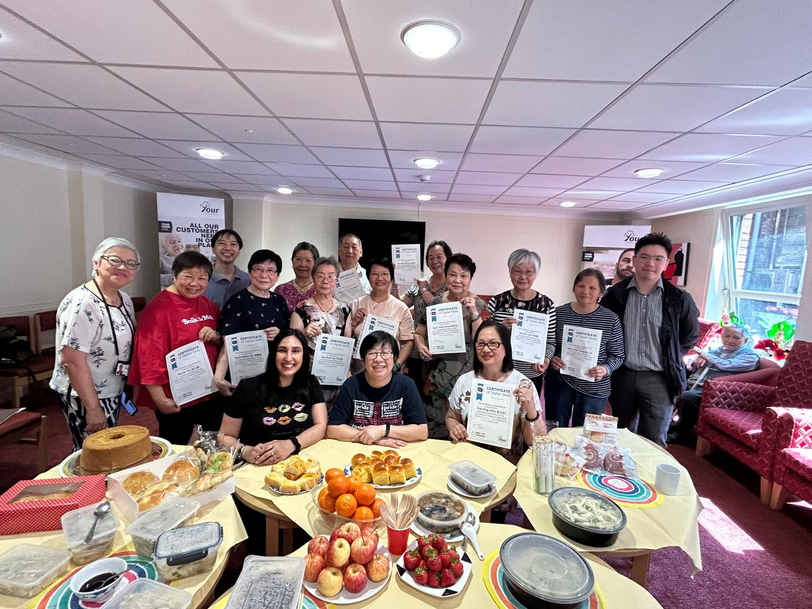 A group of our residents receiving their certificates after completing their ICT sessions